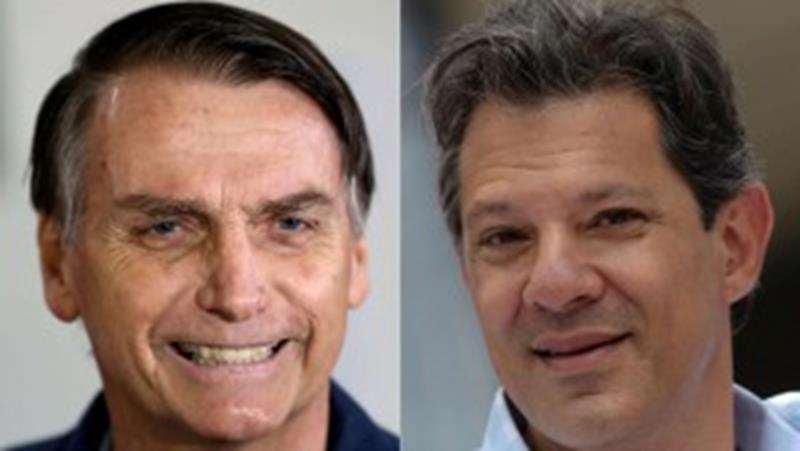 A combination of file photos shows Jair Bolsonaro, far-right lawmaker and presidential candidate of the Social Liberal Party (PSL), casts his vote in Rio de Janeiro, Brazil October 7, 2018 and Fernando Haddad, presidential candidate of Brazils leftist Workers Party (PT), attends a rally in Belo Horizonte, Brazil October 5, 2018. REUTERS/Ricardo Moraes/Washington Alves - RC1805558CC0